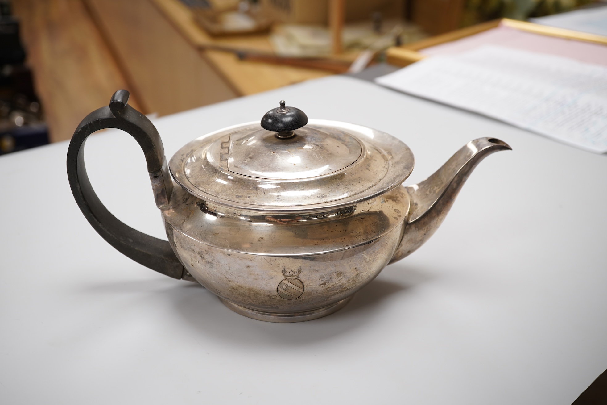 Assorted silver including a George V silver teapot by James Dixon & Sons, Sheffield, 1925, gross weight 25.6oz, an Edwardian silver sauceboat, a near pair of modern silver candlesticks, a silver matchbox holder, a pair o